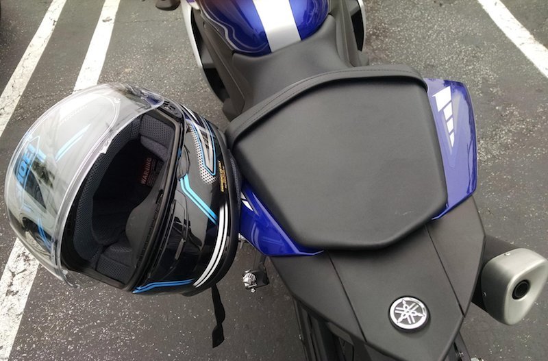 A bicycle helmet securely locked to the frame of a commuter bike.