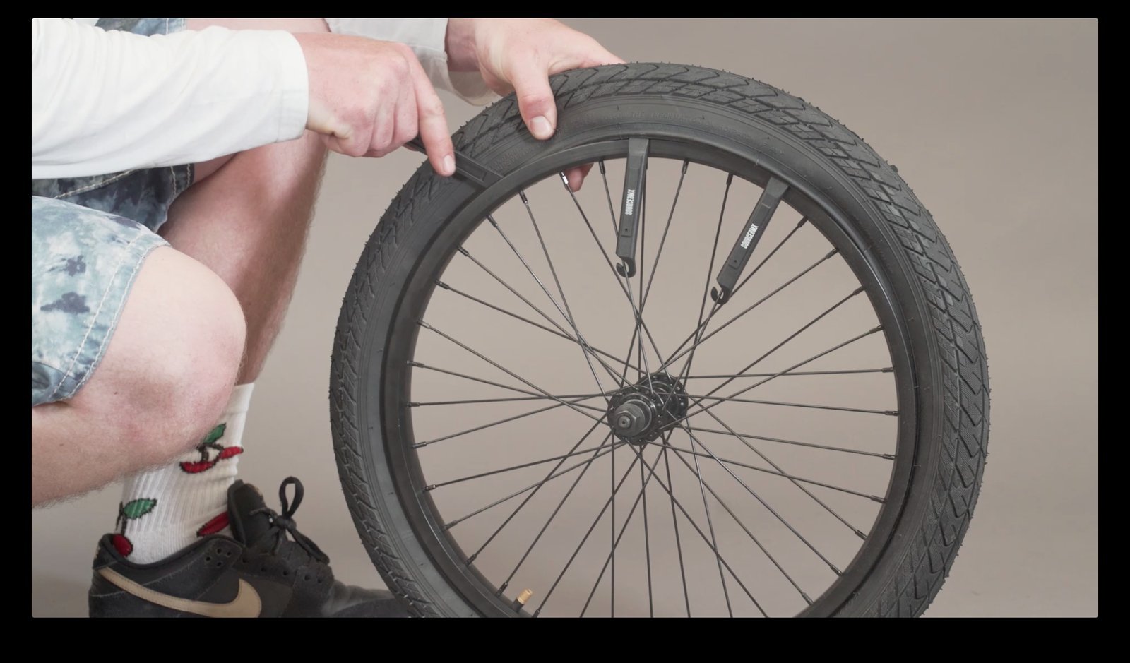 A properly seated BMX tire showing a uniform bead line along the rim.