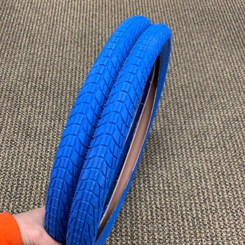 Close up inspection of the tire bead seating against the bicycle rim edge.