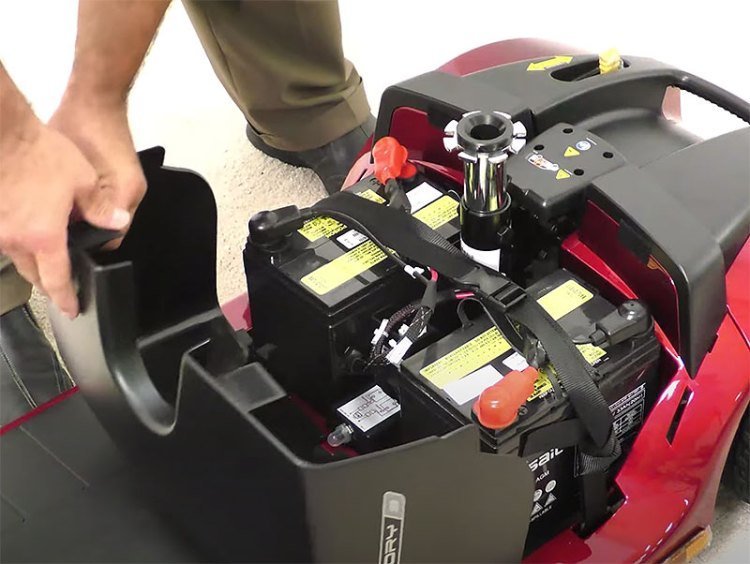 A mobility scooter console showing a full green battery light after successful maintenance.