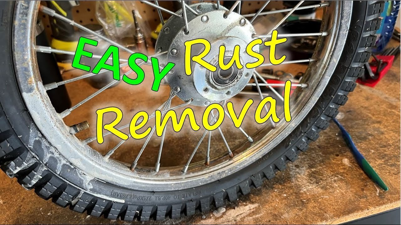 Essential cleaning supplies for dirt bike spokes arranged neatly on a workbench.