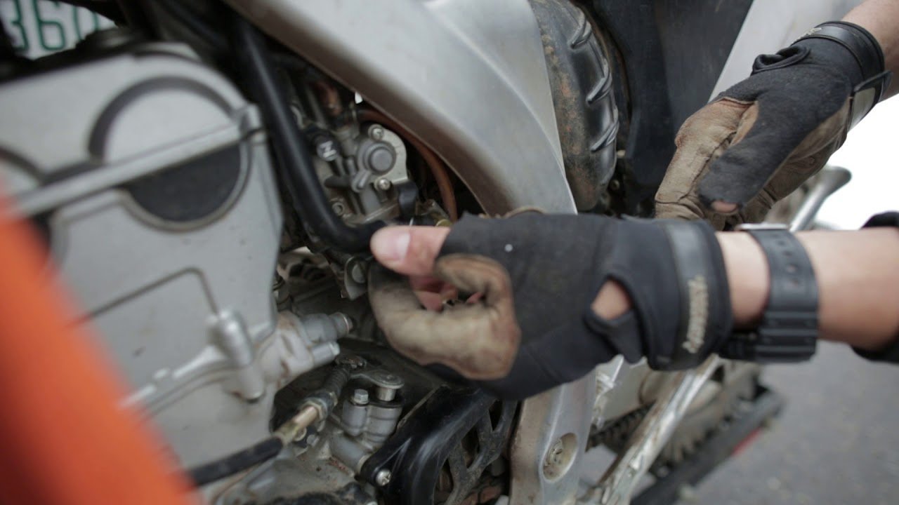 Looking into a clean and dry dirt bike fuel tank after proper draining.