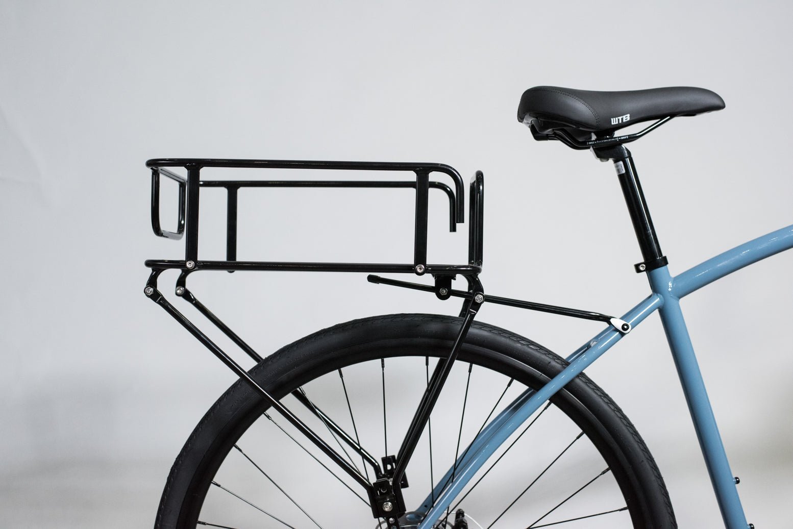 A properly installed rear bike rack sitting level on a bicycle.