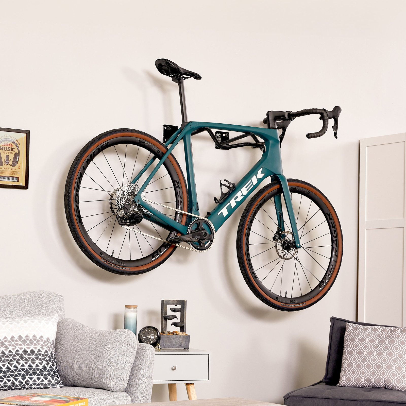 A person performing a stability test on a newly installed wall bike rack.