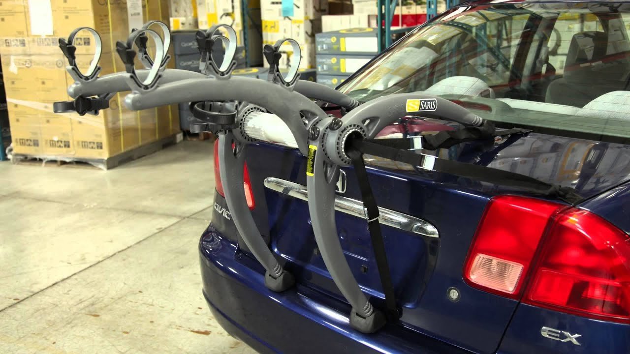 A Saris bike rack prepared for installation on the back of a car.