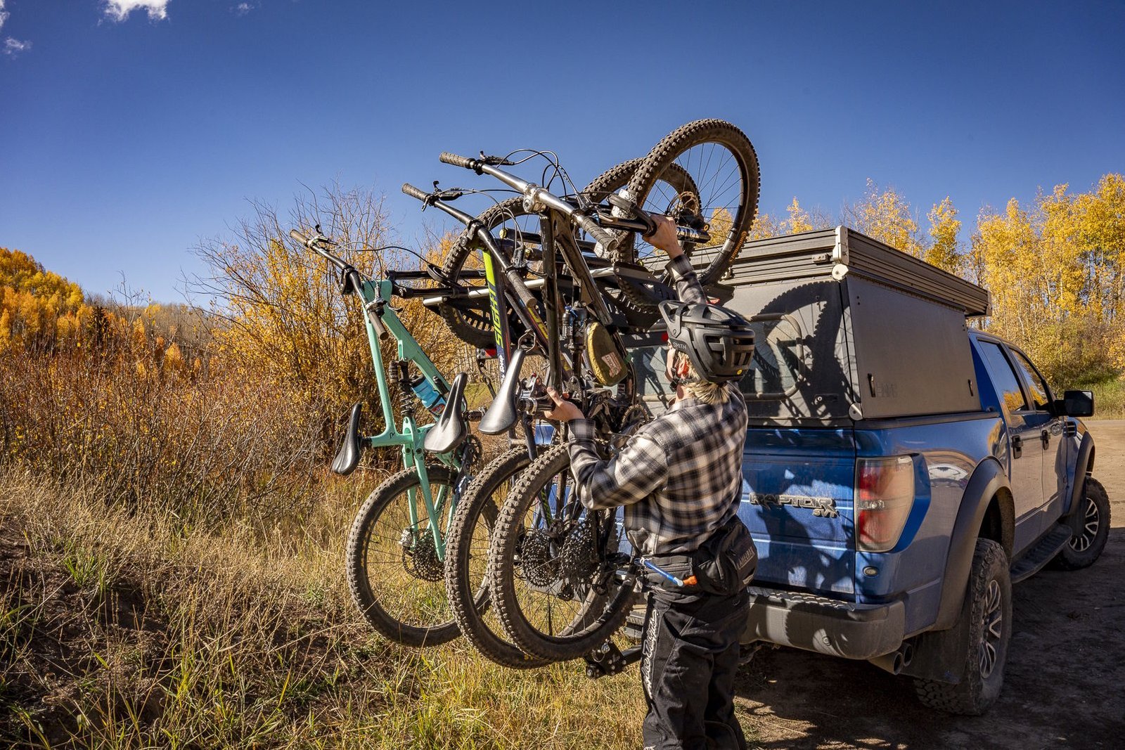 Checking the stability of loaded bikes on a rack by testing frame movement.