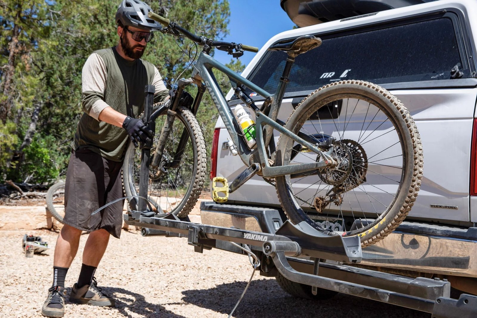A person checking bike rack instructions while preparing for a cycling trip.
