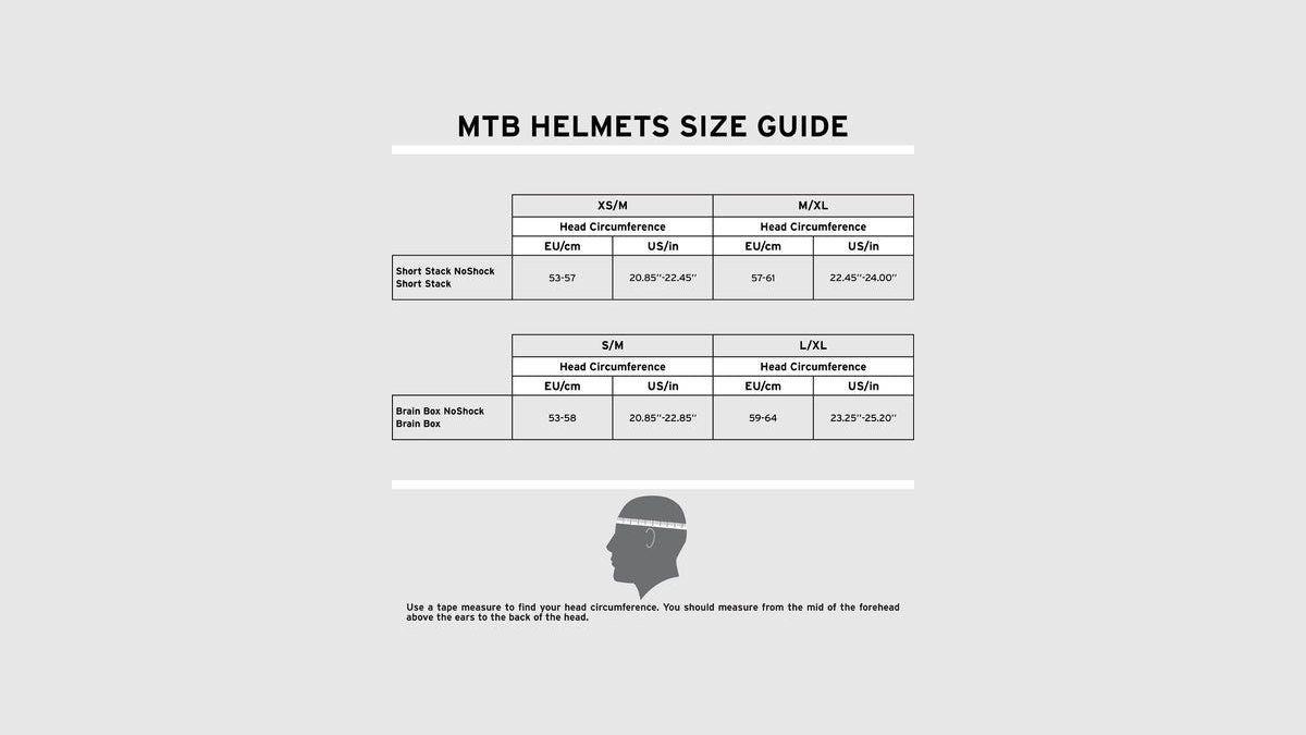 A mountain bike helmet and measuring tape used to determine proper head sizing.