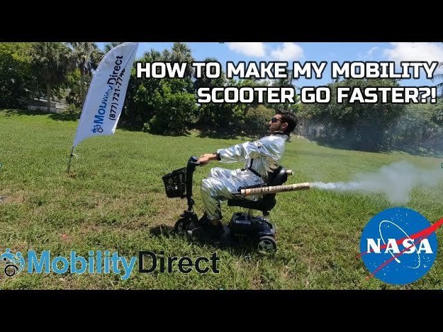 A person reading instructions on a tablet while sitting on their mobility scooter.