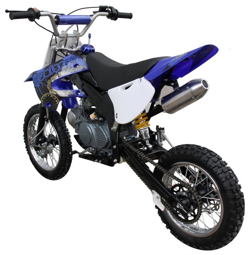 A mechanic inspecting the engine of a Coolster dirt bike in a garage.
