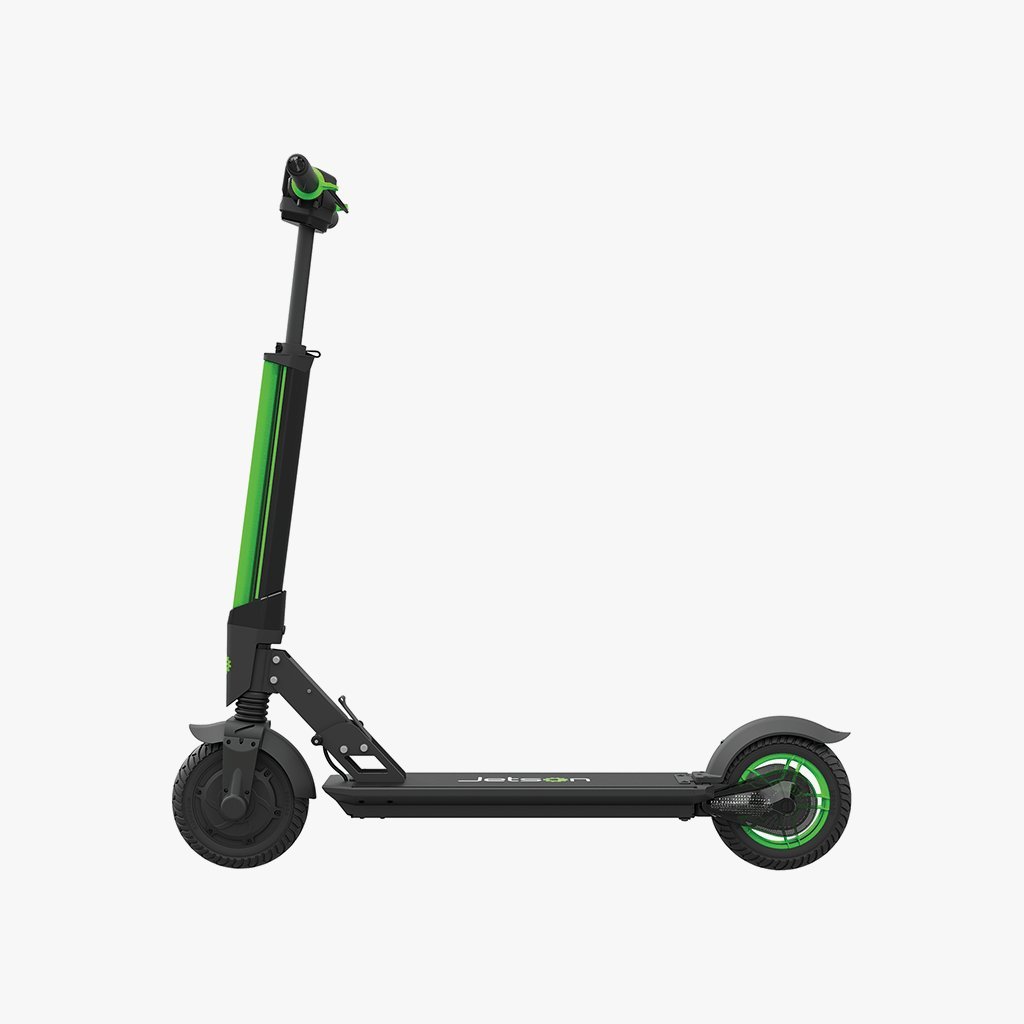 A person standing next to their electric scooter in a bright, modern room.