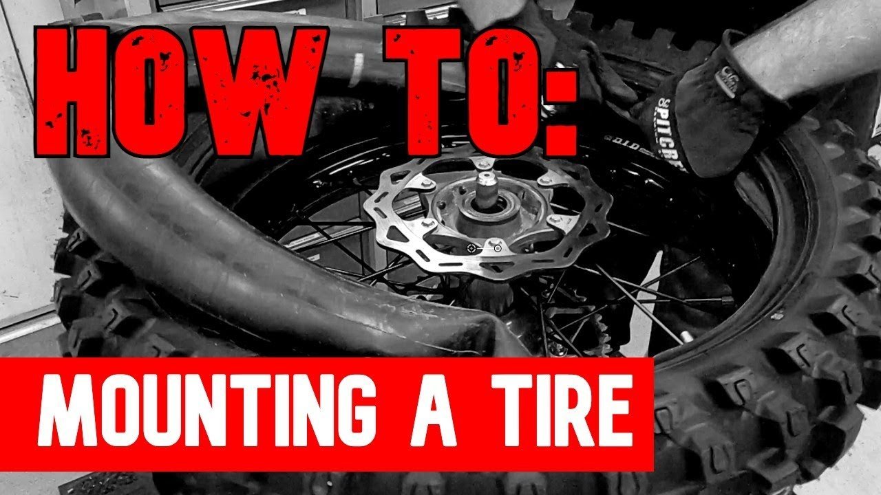 A mechanic uses a multimeter to troubleshoot dirt bike electrical systems.